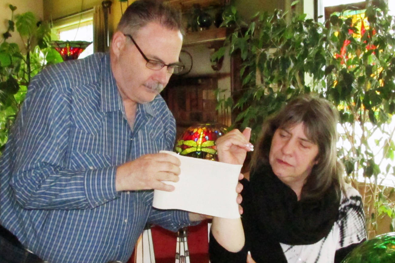 Ocean Shores ARPN Tom Miller has started offering house calls through his Facebook group called “Doc To Go.” However, he no longer accepts any insurance. Here, he applies some in-home treatment to patient Heidi Ault. Scott D. Johnston photo