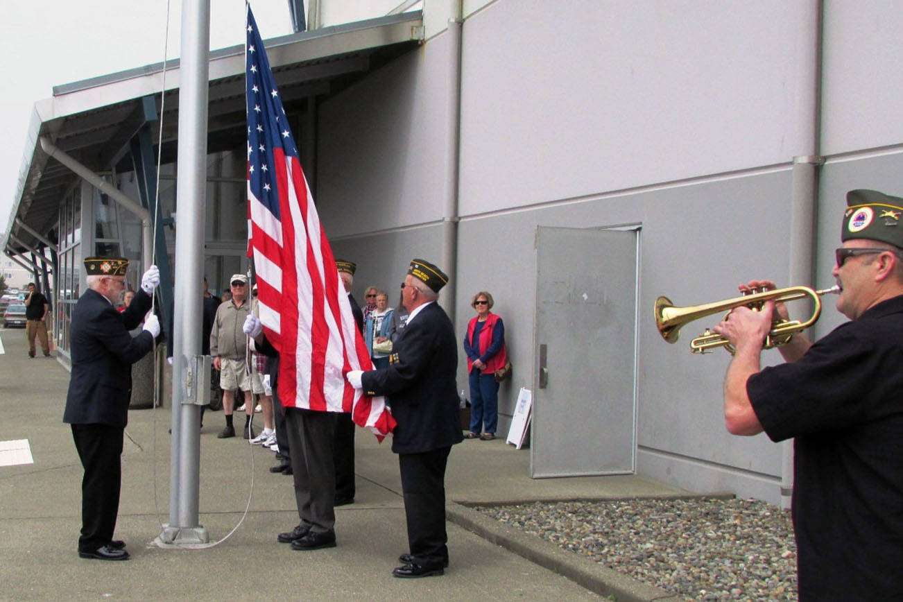 Photos by Scott D. Johnston. Members of North Beach VFW Post 8956 observed Memorial Day Saturday at the Grays Harbor Expo in Ocean Shores with a pair of patriotic ceremonies, including raising the flag outside at the Convention Center.