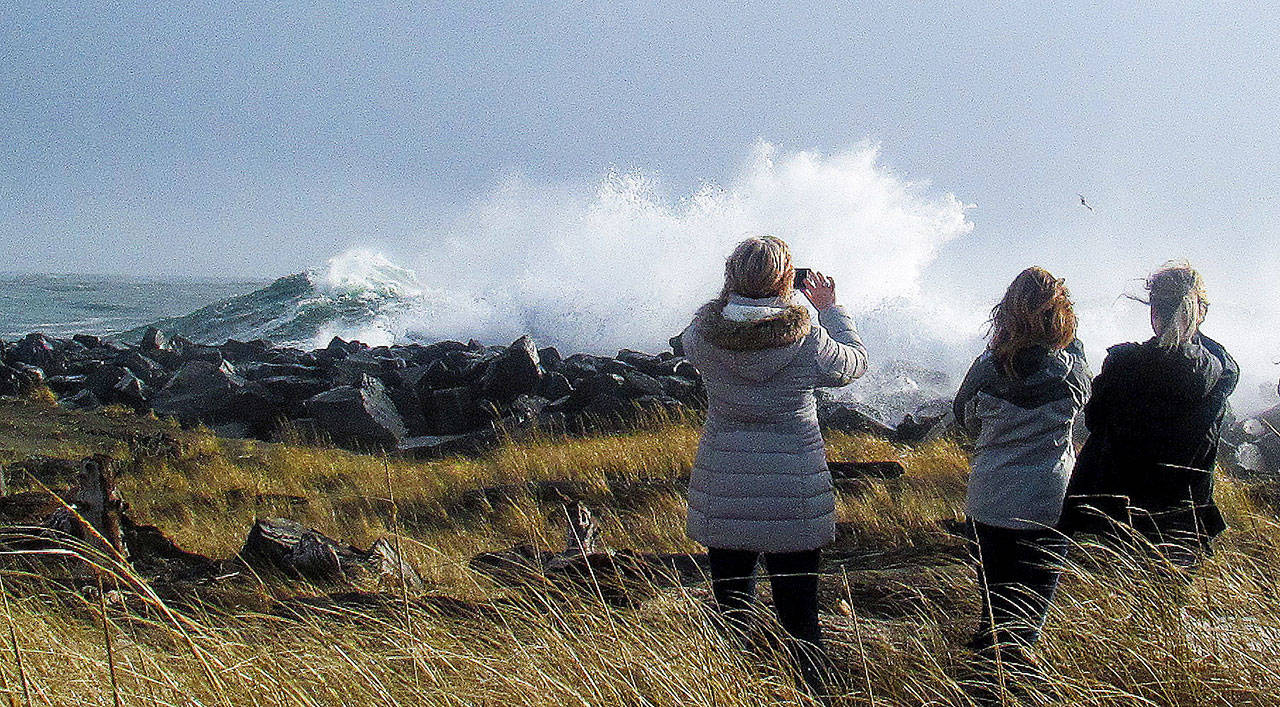 Scott D. Johnston photo: Viewers of the dramatic waves were abundant on Thursday at the Ocean Shores jetty.