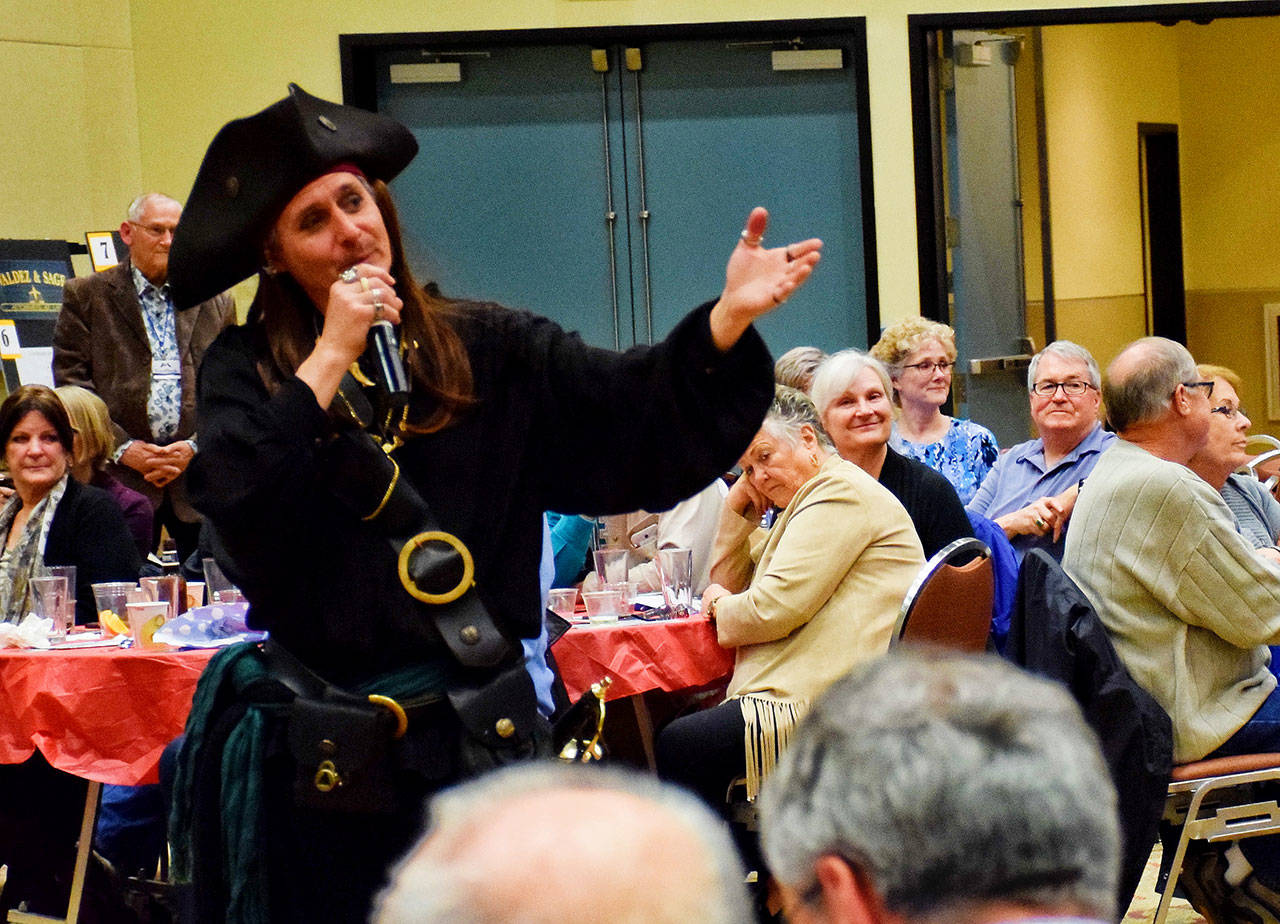 Auctioneer and emcee Eric Bjella works the crowd at the Ocean Shores Food Bank’s sold out fund raising event Saturday night at the Ocean Shores Convention Center.