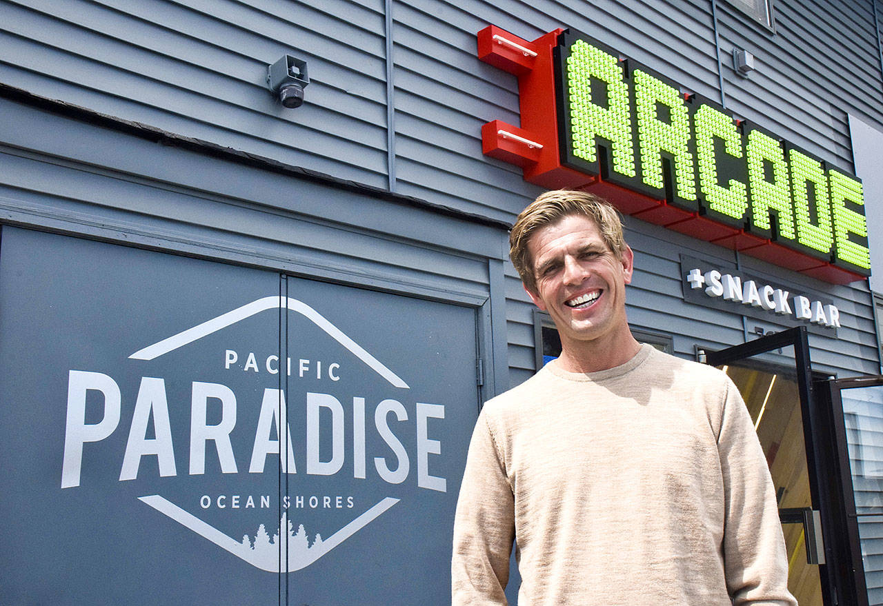 James Austin poses in front of his recently renovated and reopened Pacific Paradise Park family fun center, located behind the Ocean Shores Convention Center at 767 Minard Ave. (Photo by Scott D. Johnston)