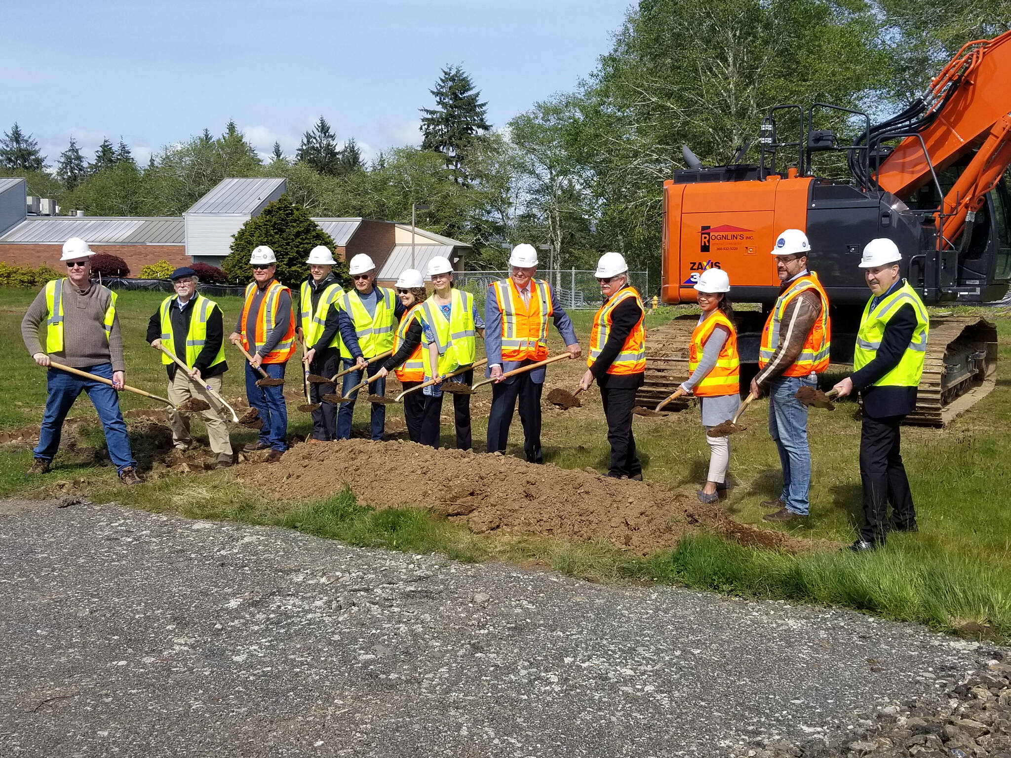 Grays Harbor College Board members and Facility staff pose for the celebratory “Groundbreaking” ceremony to kick off the beginning of the SSIB construction on May 17, 2022, at Grays Harbor College, in Aberdeen. Allen Leister l The Daily World